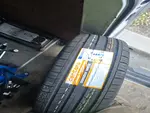 Brand new replacement tyre with manufacturer label inside mobile tyre fitting van