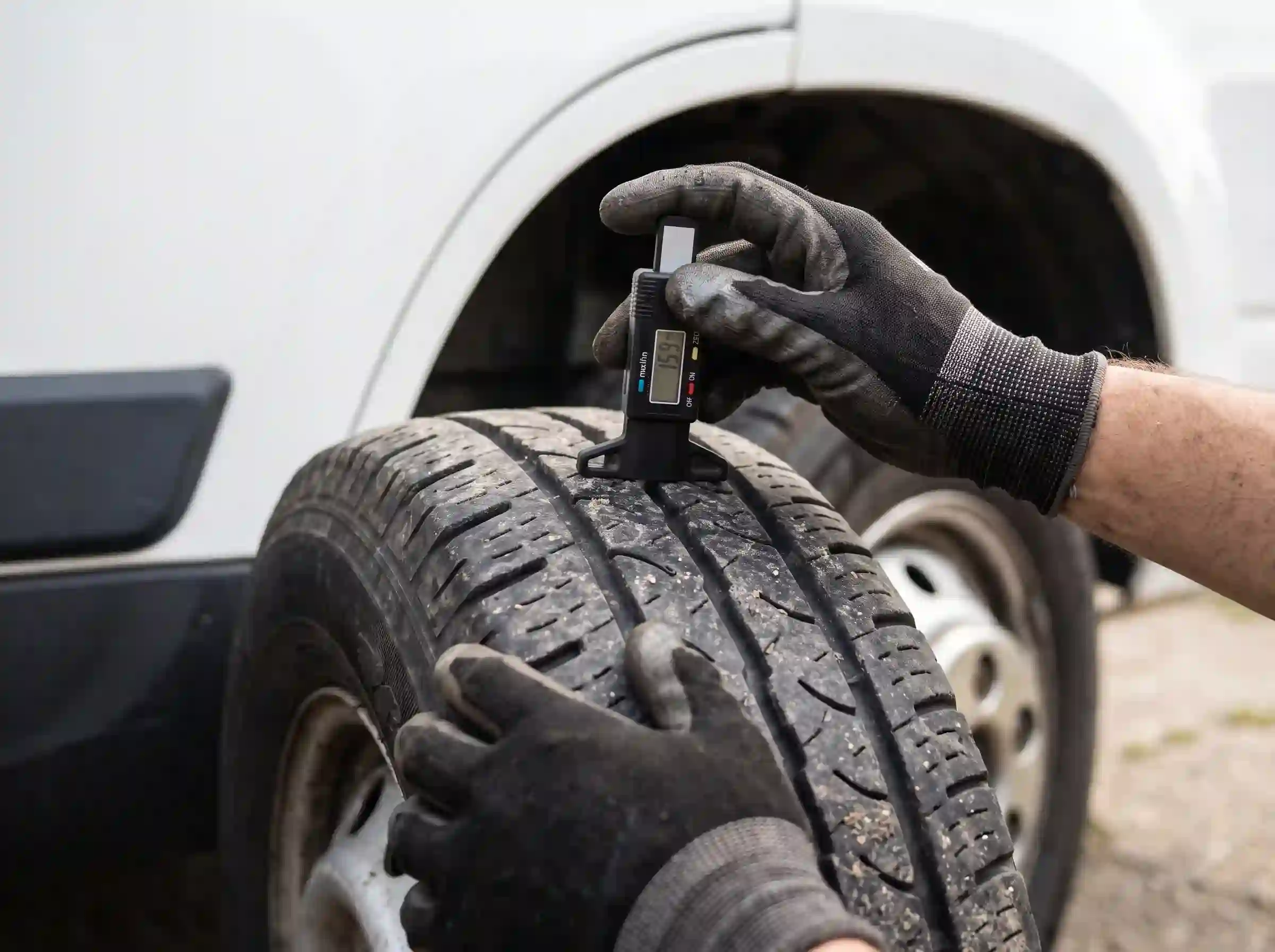 Technician checking tyre pressure on commercial tyres in London