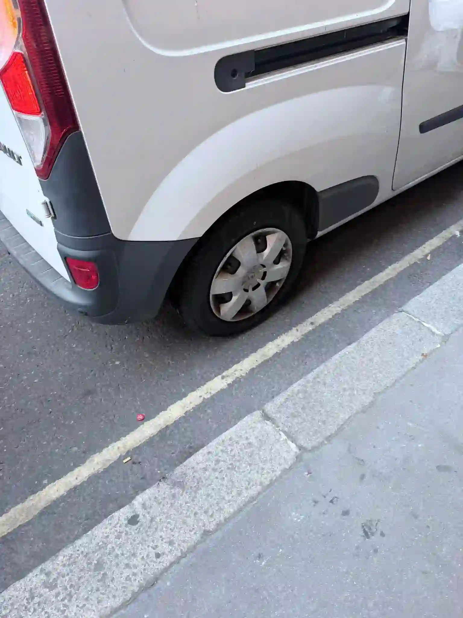 Mobile technician fitting a van tyre at a London depot