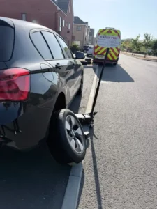 FlatFix Tyre technician changing and balancing an alloy car wheel on-site in London