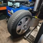 FlatFix mobile tyre fitting technician installing replacement car tyres in London