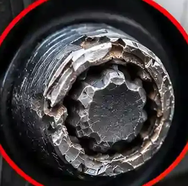 Close Up Rounded and Damaged Locking Wheel Nut Close Up Rounded and Damaged Locking Wheel Nut